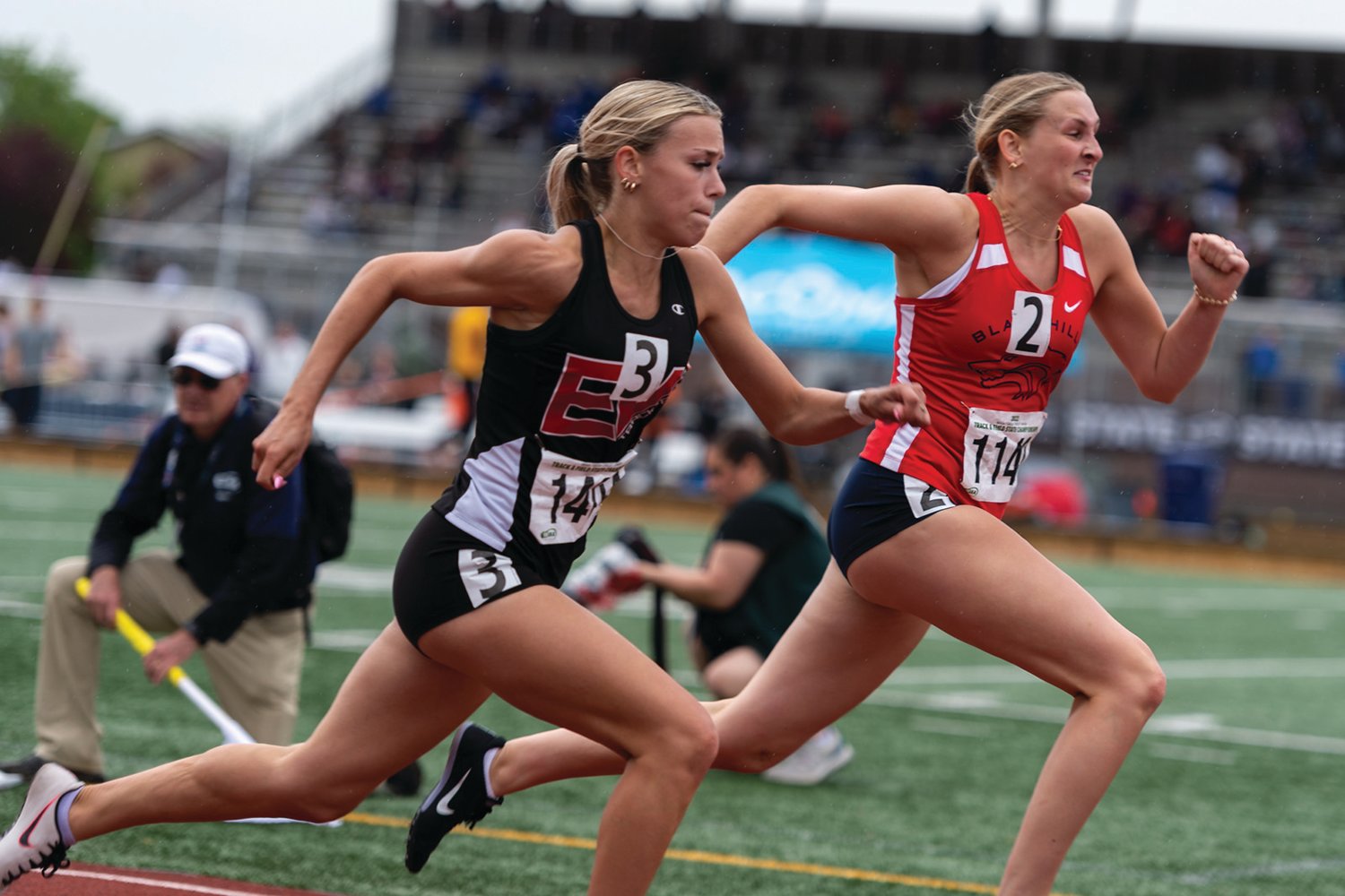 East Valley's Allison Bryan and Black Hills' Olivia Hisaw stretch to the finish line in a 2A Girls 100 Hurdles prelim at the 2A/3A/4A State Track and Field Championships on Thursday, May 26, 2022, at Mount Tahoma High School in Tacoma. (Joshua Hart/For The Chronicle)